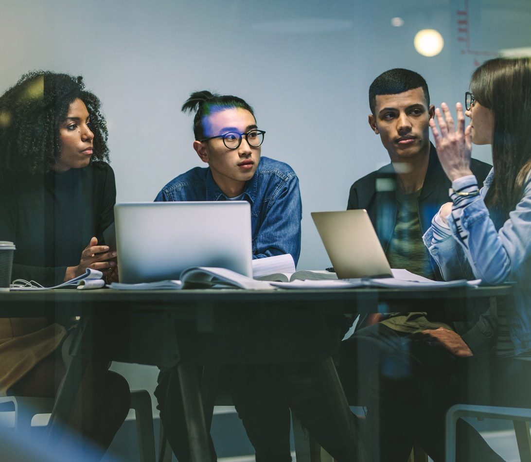 University students working in a meeting room cyber security services